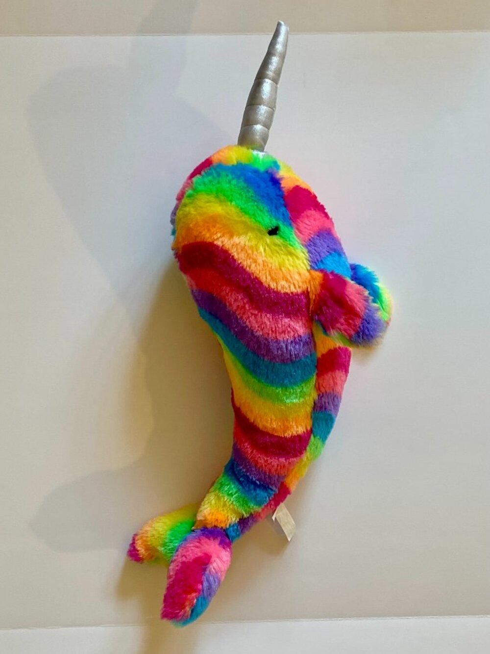 Rainbow stripped Narwhal with silver horn
